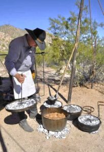 Daniel Ryan cooking with his Dutch ovens on the trail. 
