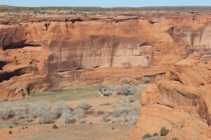 Standing at the top of Canyon de Chelly looking down at a Tribal member's home. 